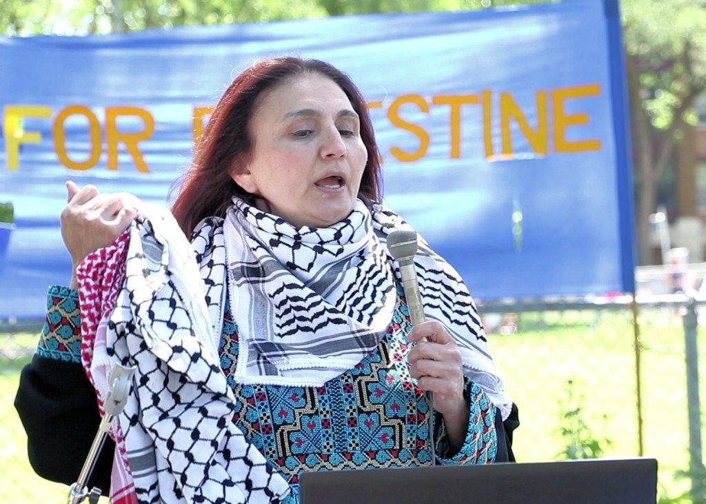 Winnipeg, June 11, 2016: Human rights activist Rana Abdulla spoke at the Winnipeg Walk for Peace on the history and significance of a traditional Palestinian scarf knows as the keffiyeh. Photo: Paul S. Graham