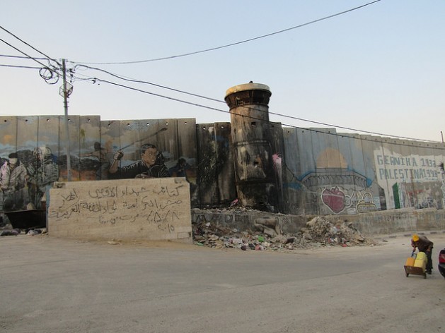 An eight-meter-high "security wall" borders part of the Aida refugee camp, 1.5 km north of the city of Bethlehem. Credit: Fabiola Ortiz/IPS