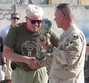 Canadian entertainer Bruce Cockburn was part of a group of entertainers who performed at a forward operating base in the Panjwaii district of Afghanistan on Thursday, Sept. 10, 2009. After Cockburn sung If I Had a Rocket Launcher Gen. Jonathan Vance jokingly presented him with a rocket launcher of his own.THE CANADIAN PRESS/Bill Graveland