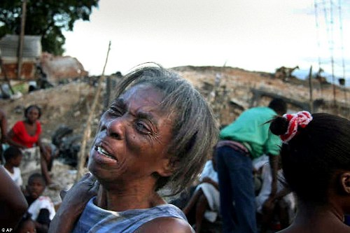 The earthquake laid waste to much of the Haitian capital Port-au-Prince, including this woman's home in a shanty town on the outskirts of the city. Photo: Associated Press.